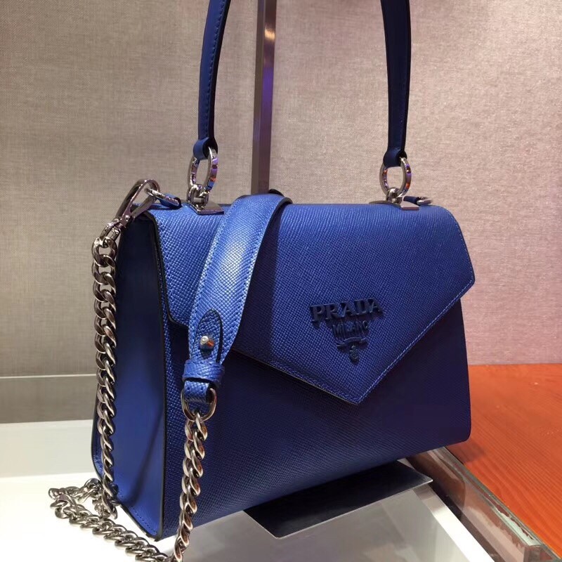 pra*a monoCh*0me top handle bag in blue saffiano leather