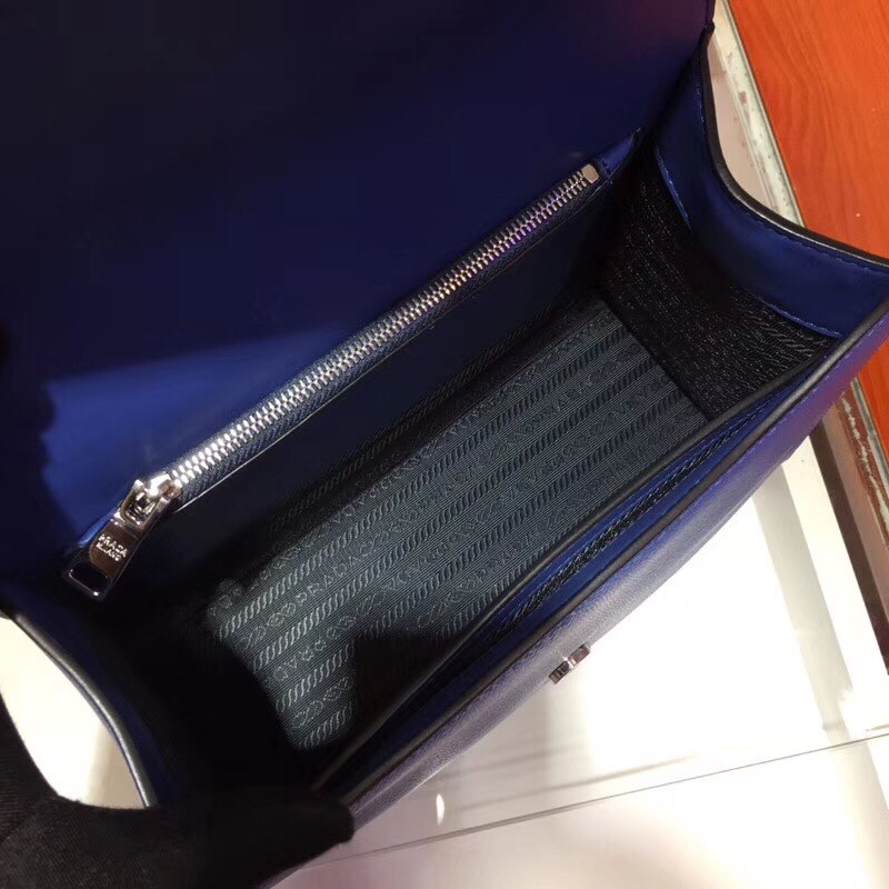 pra*a monoCh*0me top handle bag in blue saffiano leather