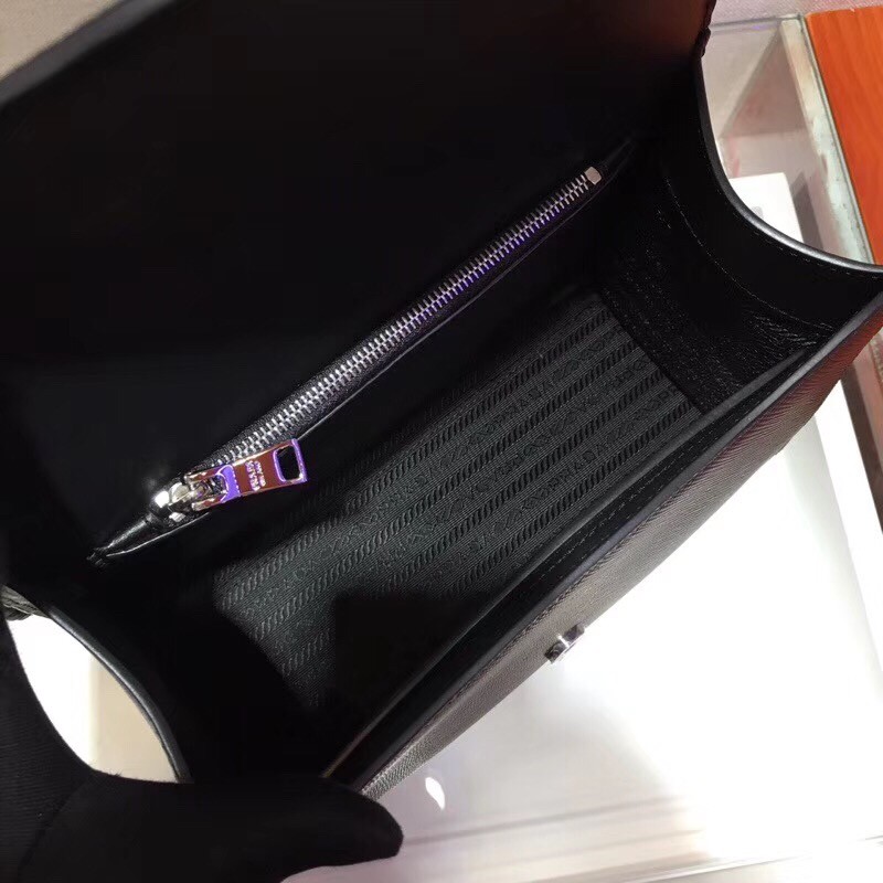 pra*a monoCh*0me top handle bag in black saffiano leather