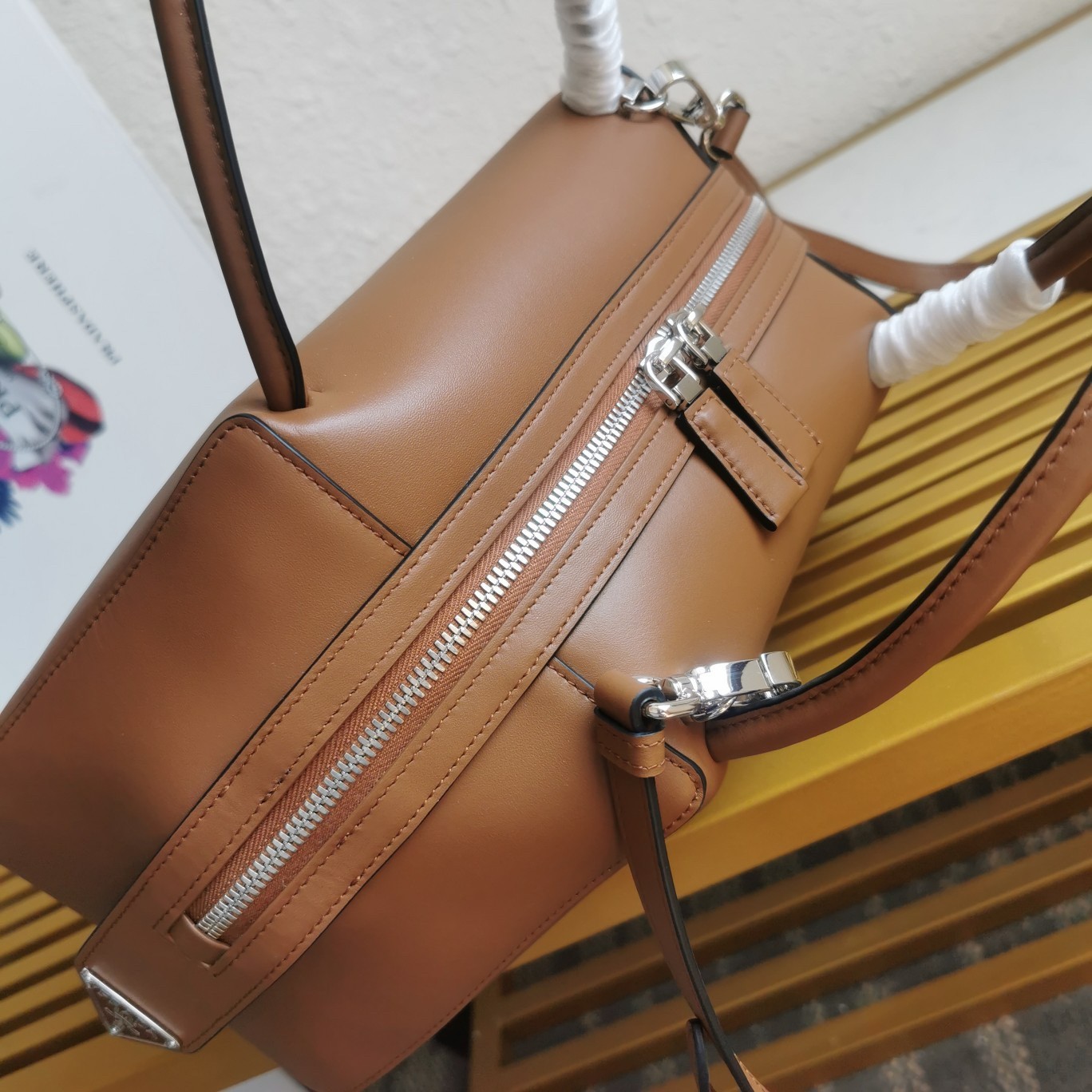 pra*a S*pernova medium handbag in brown leather