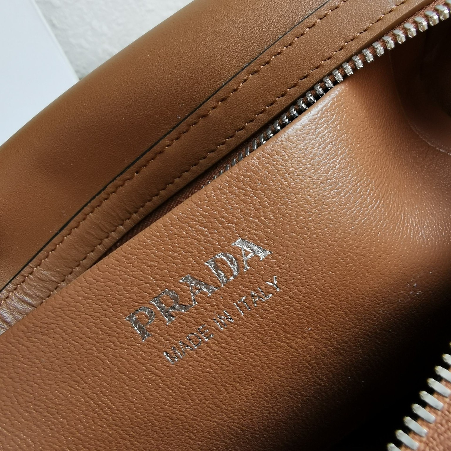 pra*a S*pernova medium handbag in brown leather