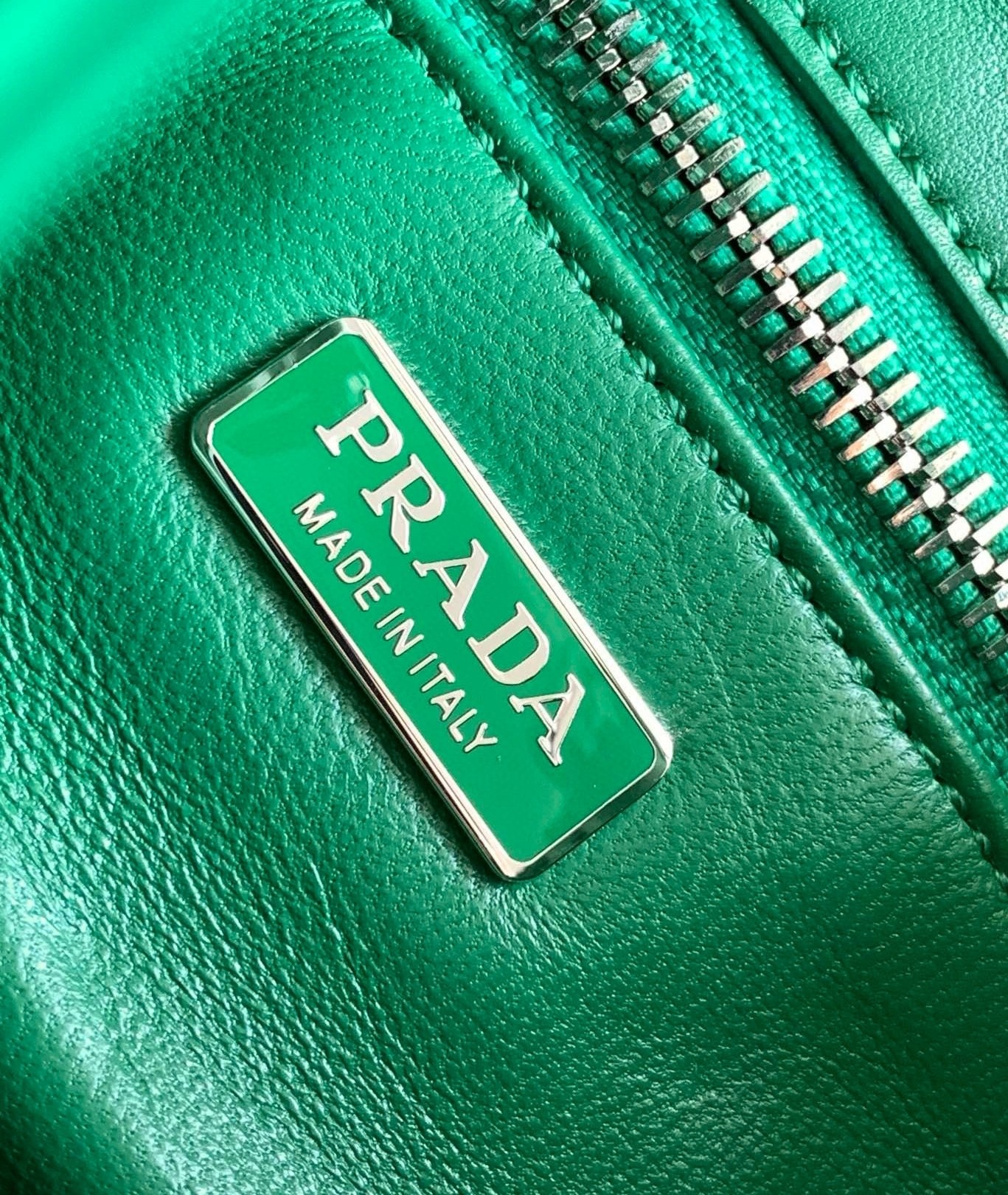 Pra*a moon bag in green padded nappa leather