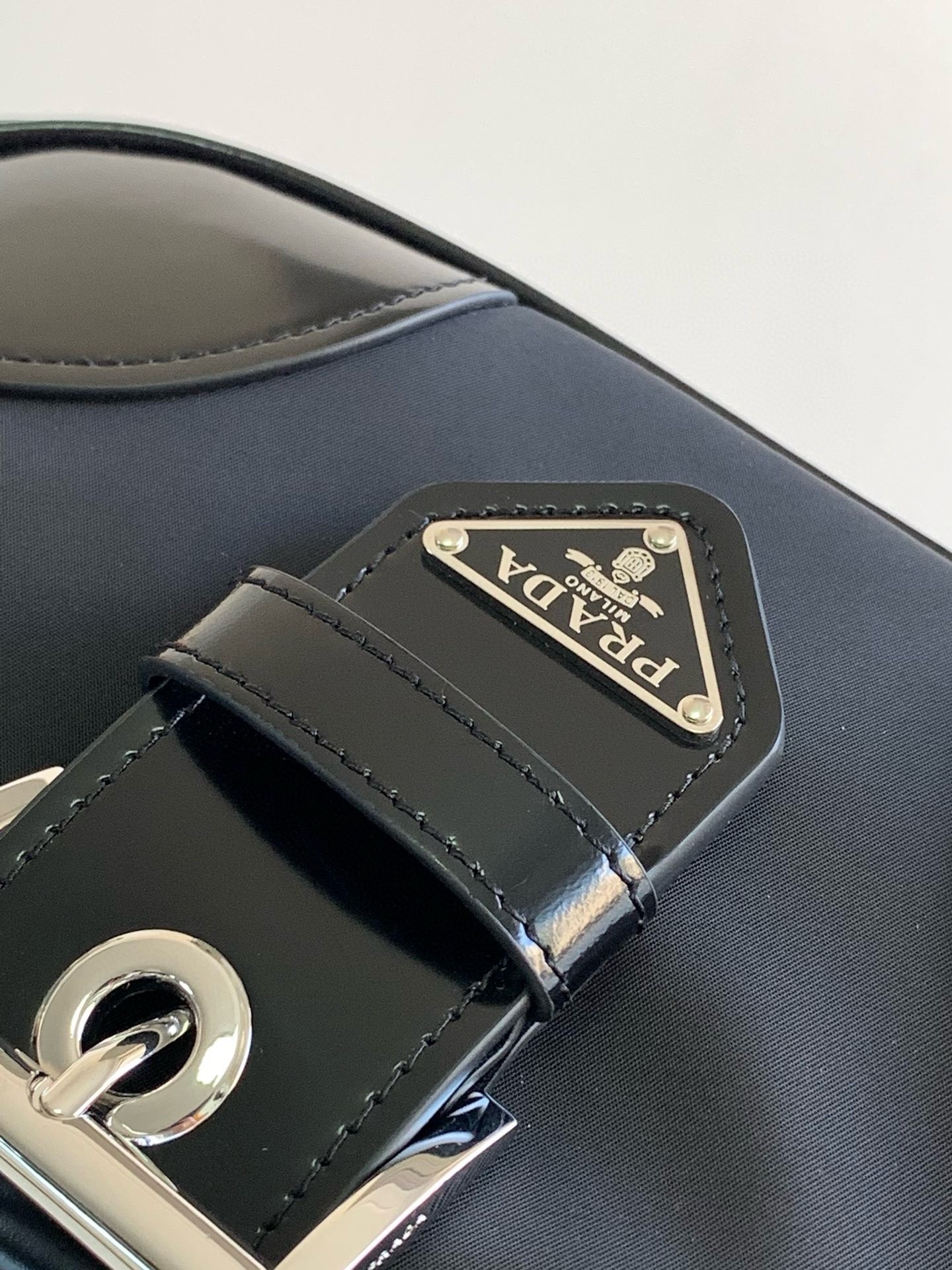 Pra*a moon bag in black padded nappa leather