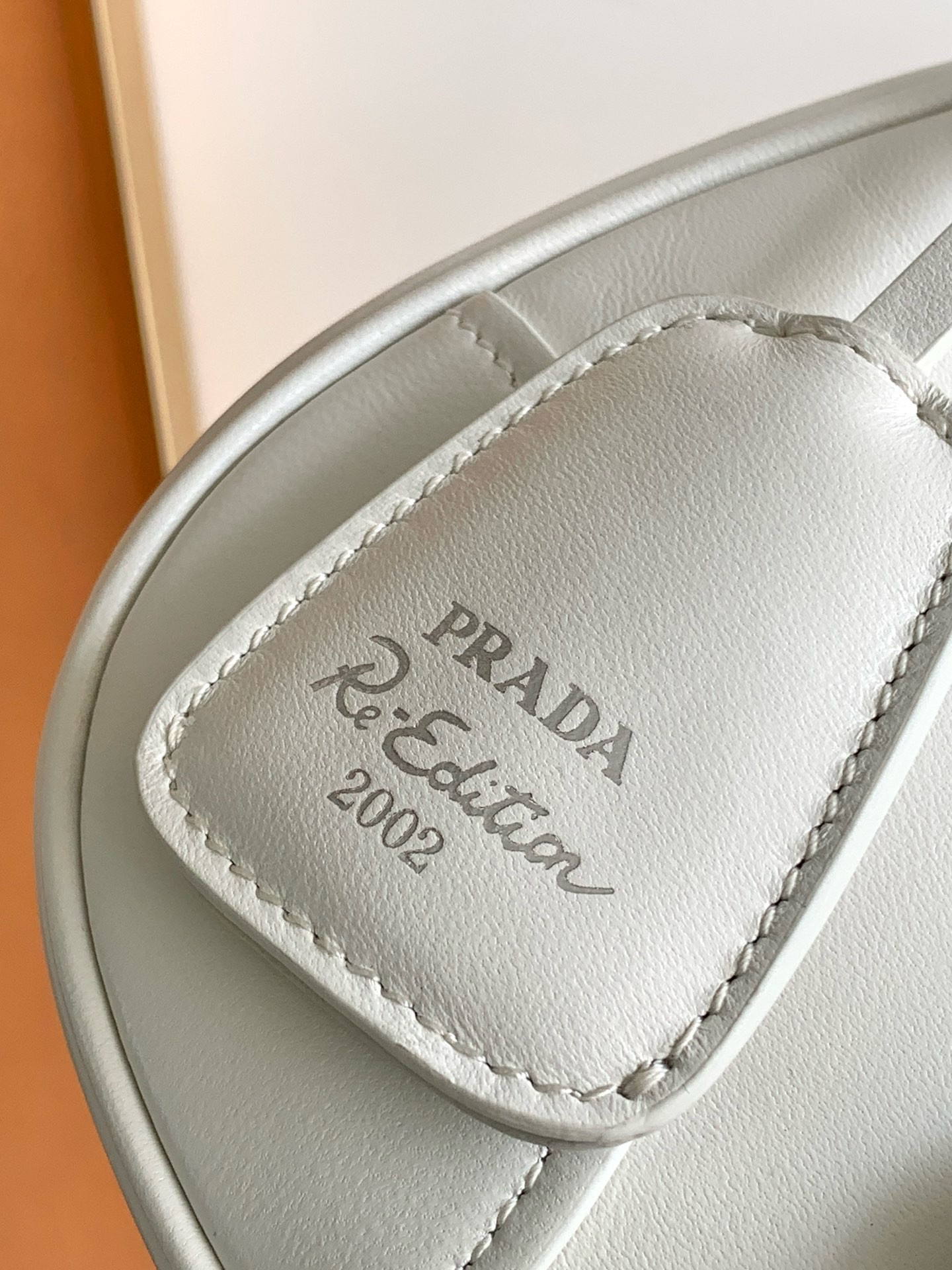Pra*a moon bag in white padded nappa leather