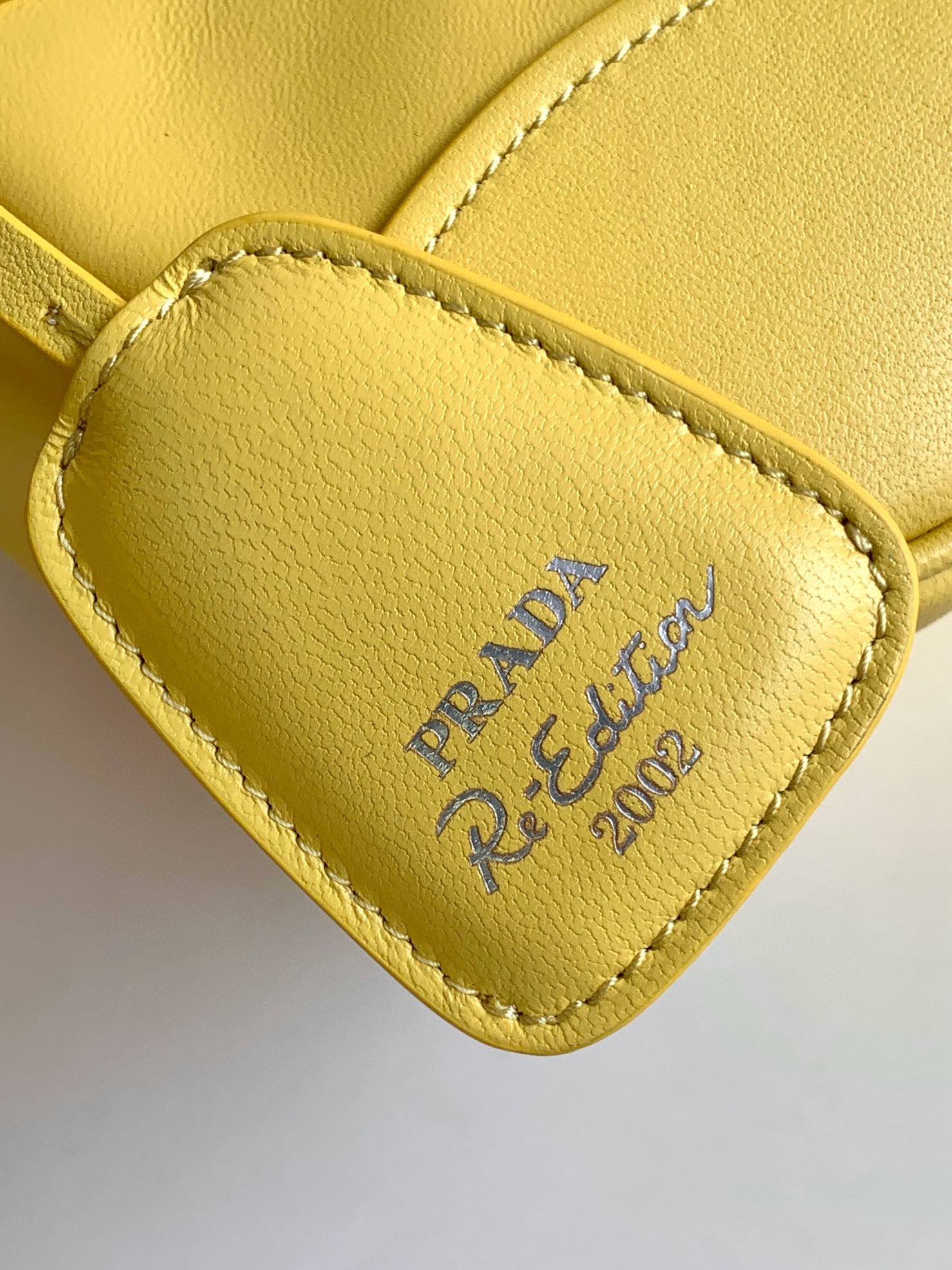 Pra*a moon bag in yellow padded nappa leather
