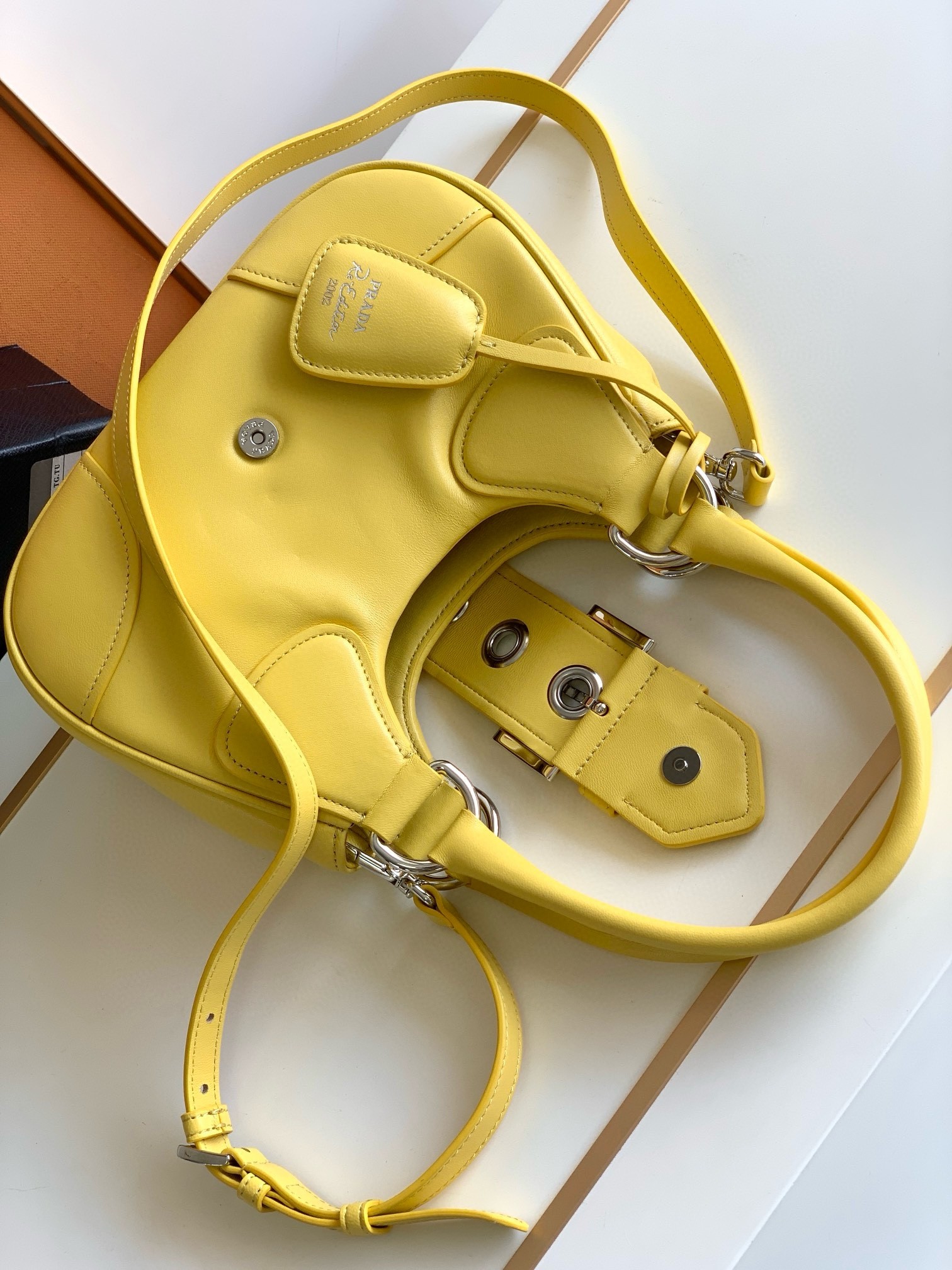 Pra*a moon bag in yellow padded nappa leather
