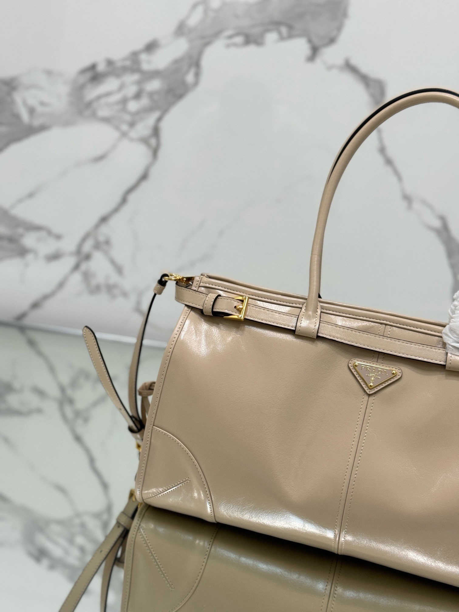 Pra*a large tote bag in beige soft leather