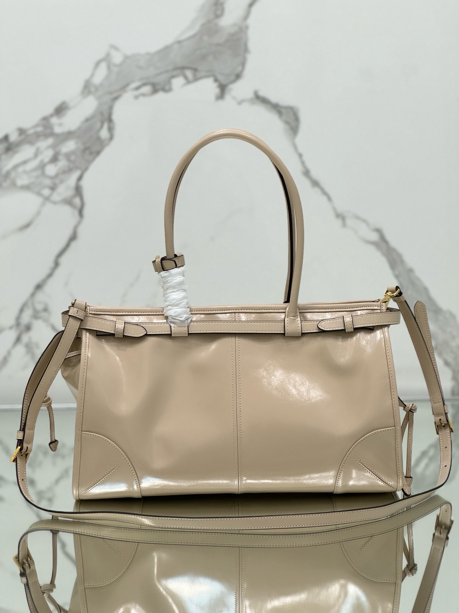 Pra*a large tote bag in beige soft leather