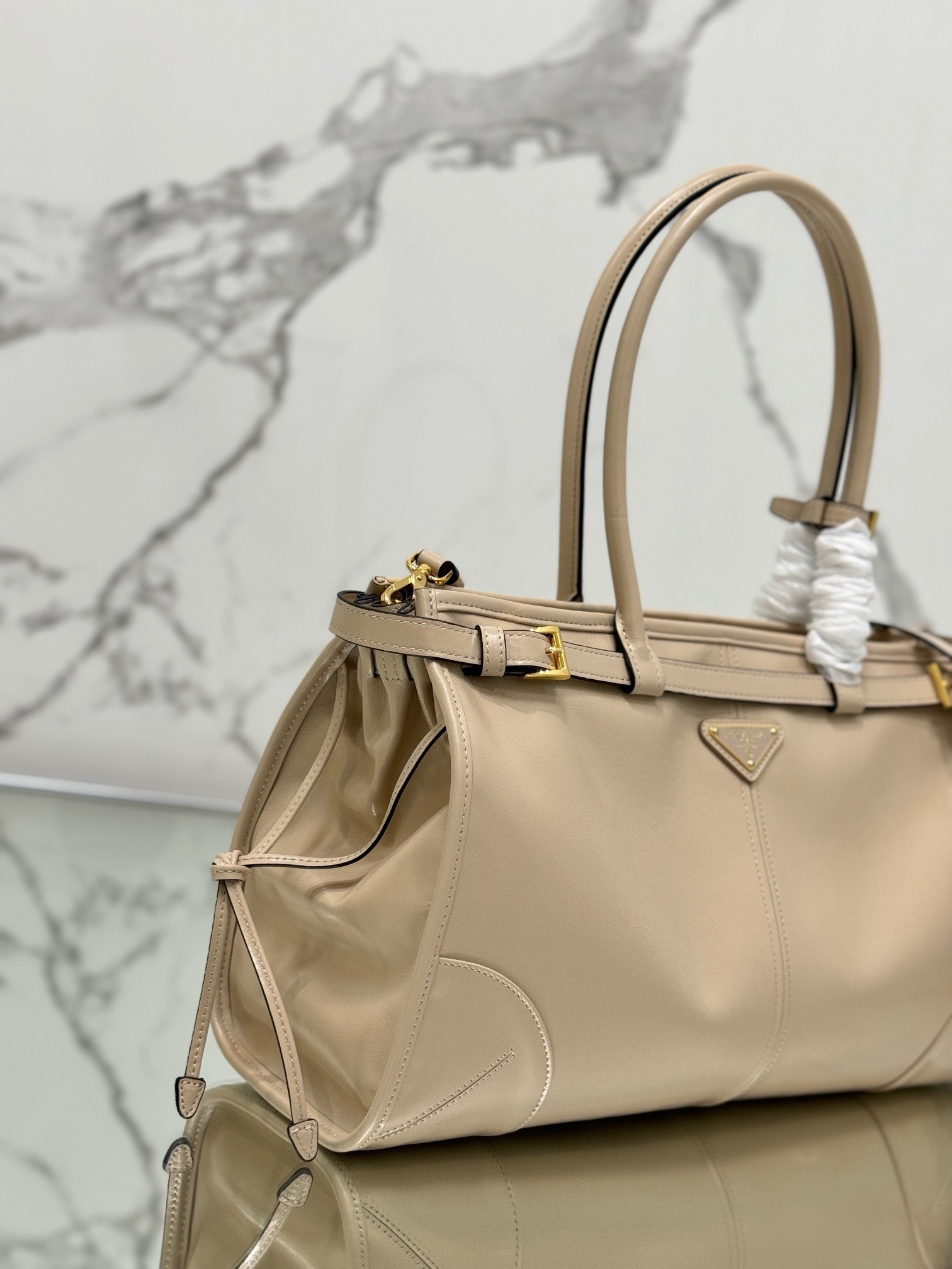 Pra*a large tote bag in beige soft leather