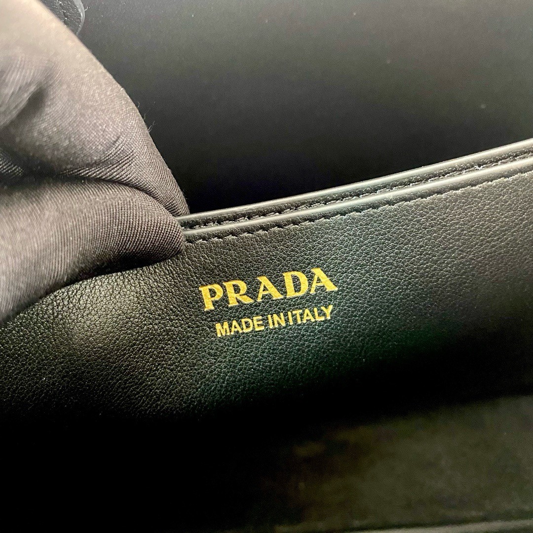 Pra*a buckle medium bag with belt in black leather