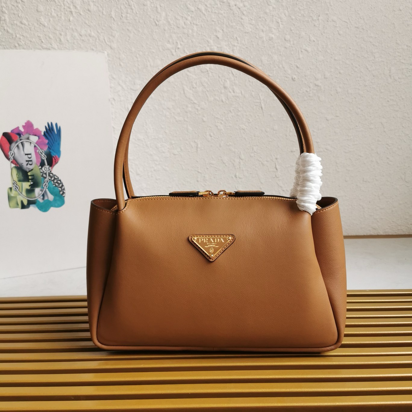 Pra*a shoulder bag in brown calfskin with triangle logo