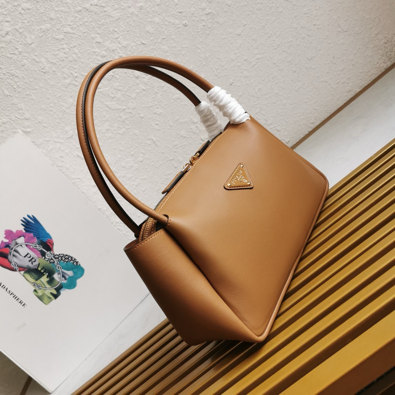 Pra*a shoulder bag in brown calfskin with triangle logo