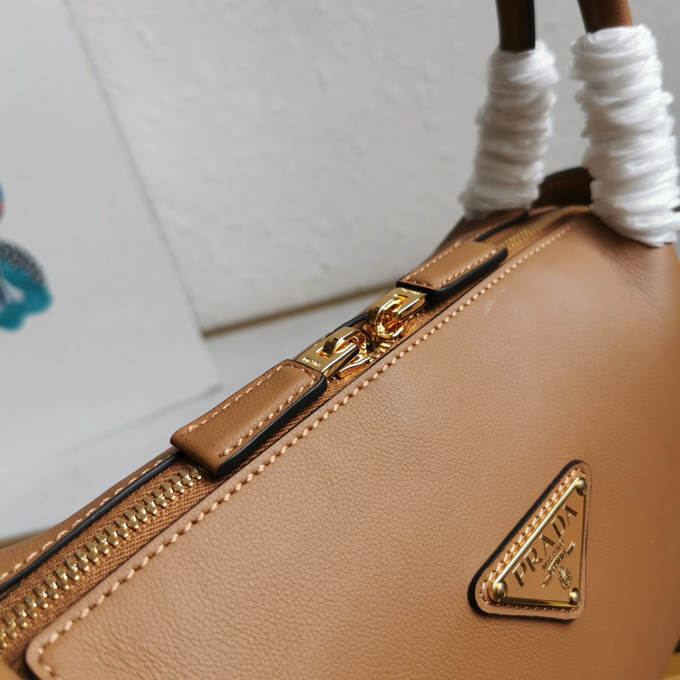 Pra*a shoulder bag in brown calfskin with triangle logo