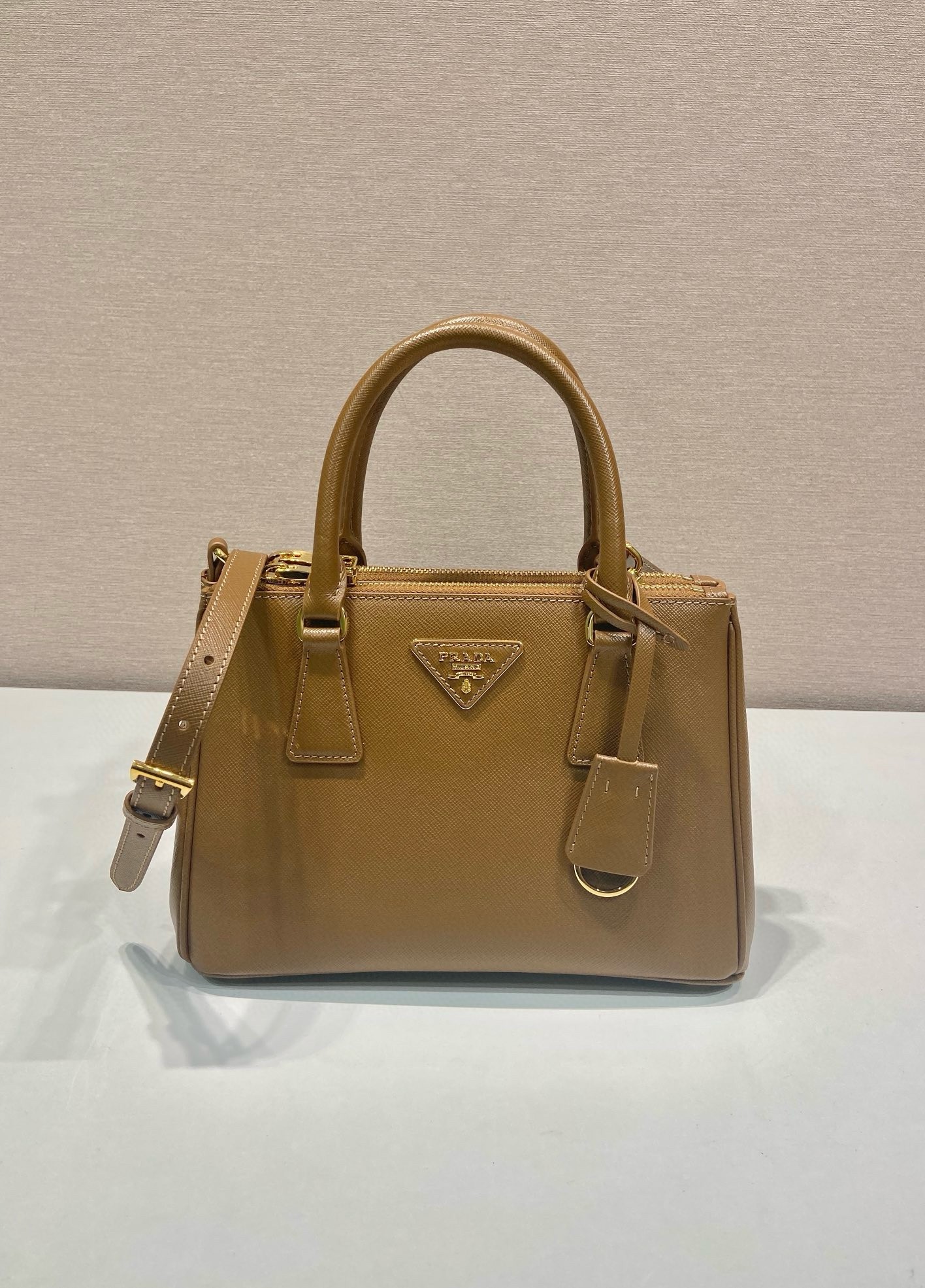 Pra*a galleria small bag in caramel saffiano leather