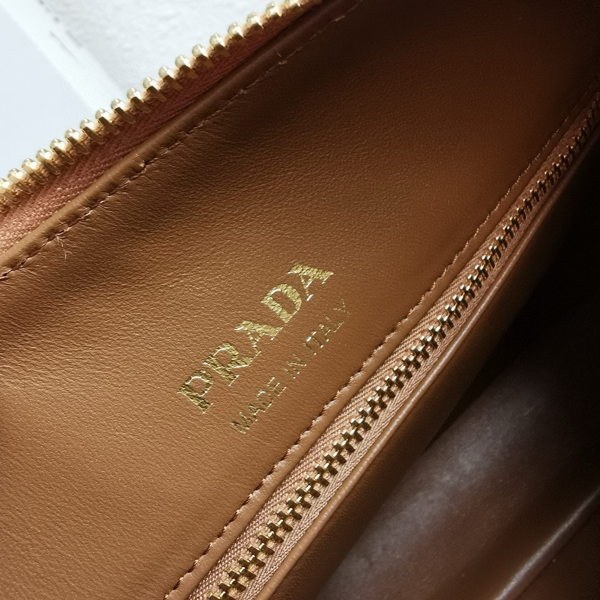 Pra*a shoulder bag in brown grained leather
