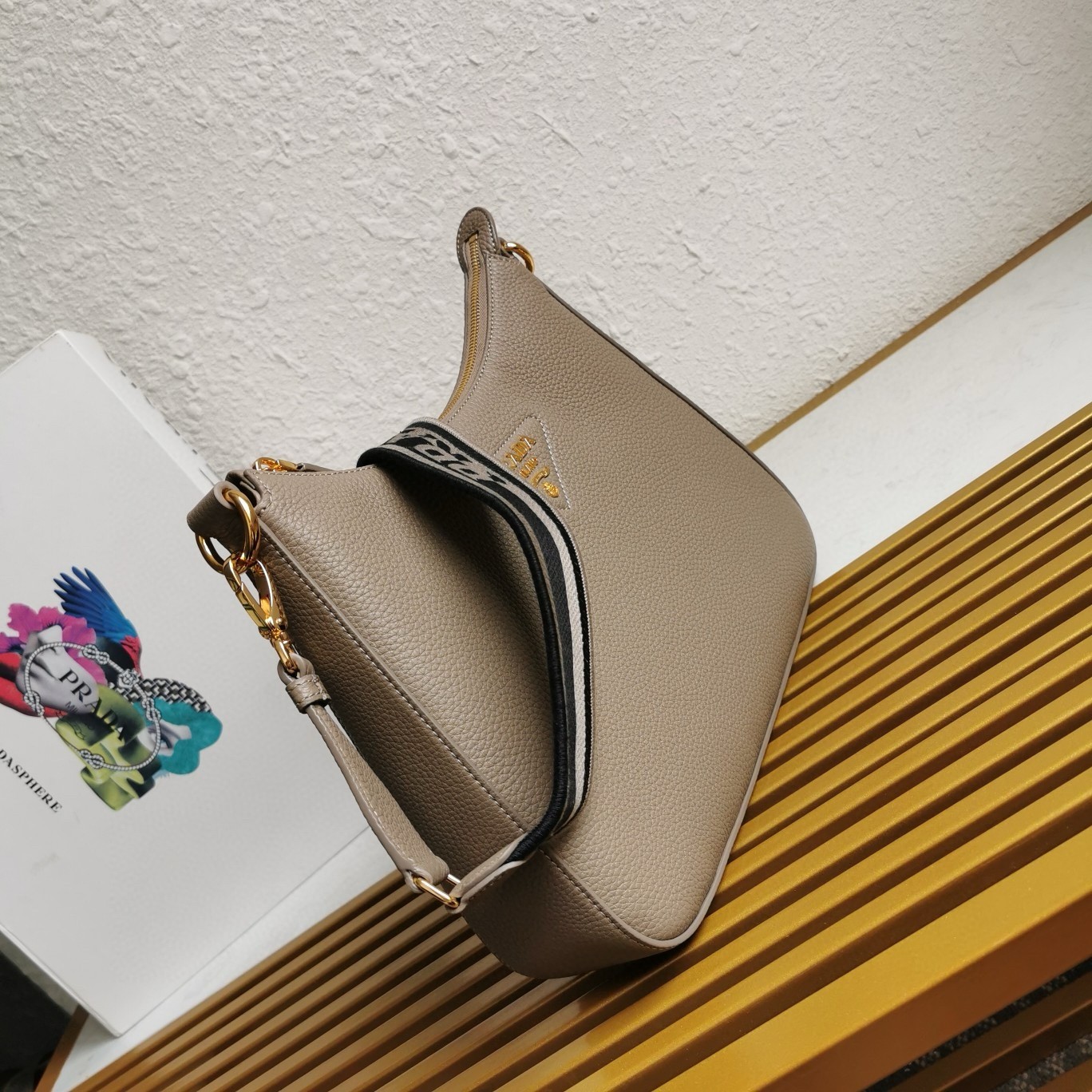 Pra*a shoulder bag in grey grained leather