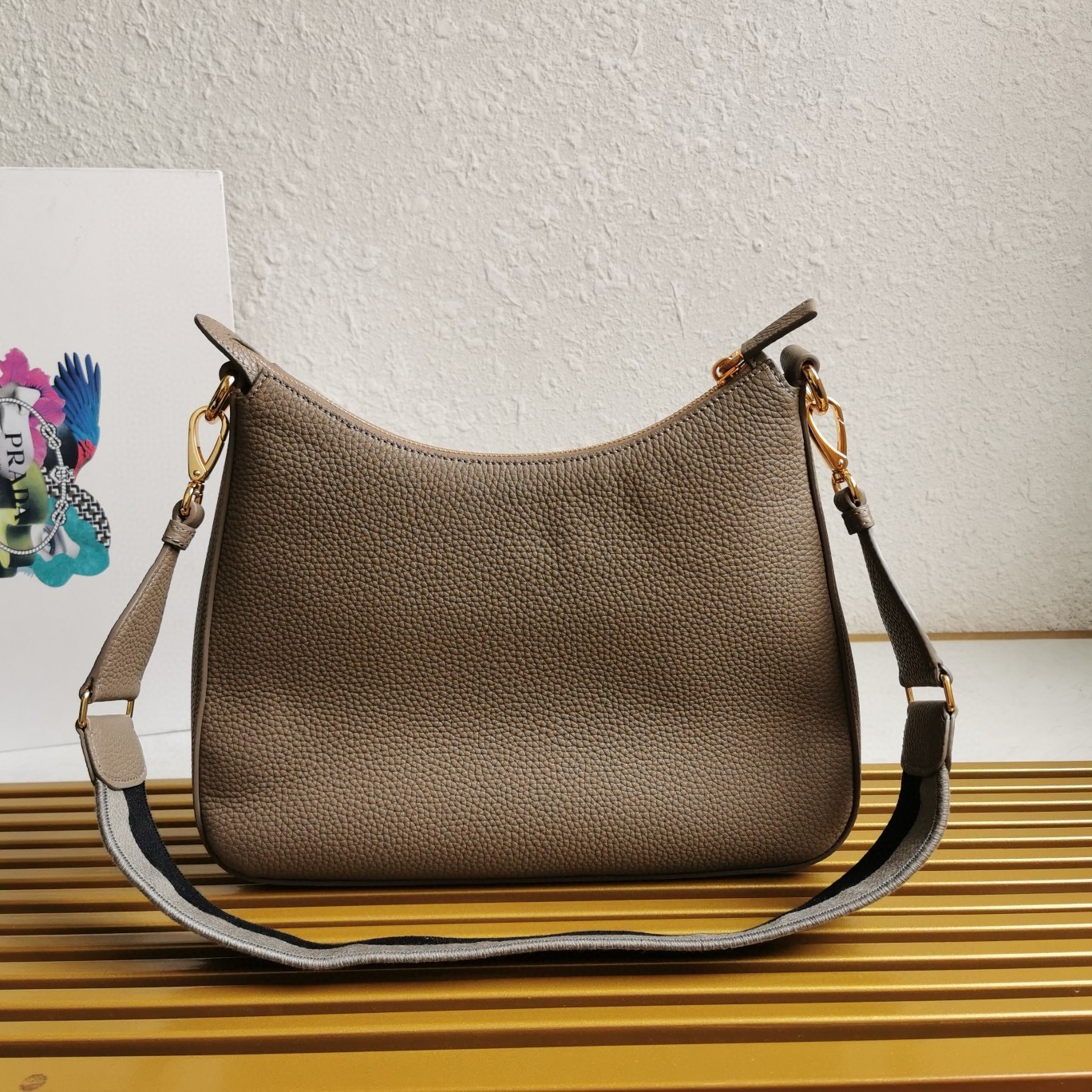Pra*a shoulder bag in grey grained leather