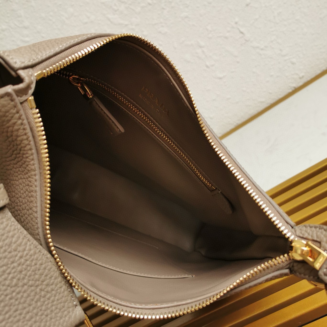 Pra*a shoulder bag in grey grained leather