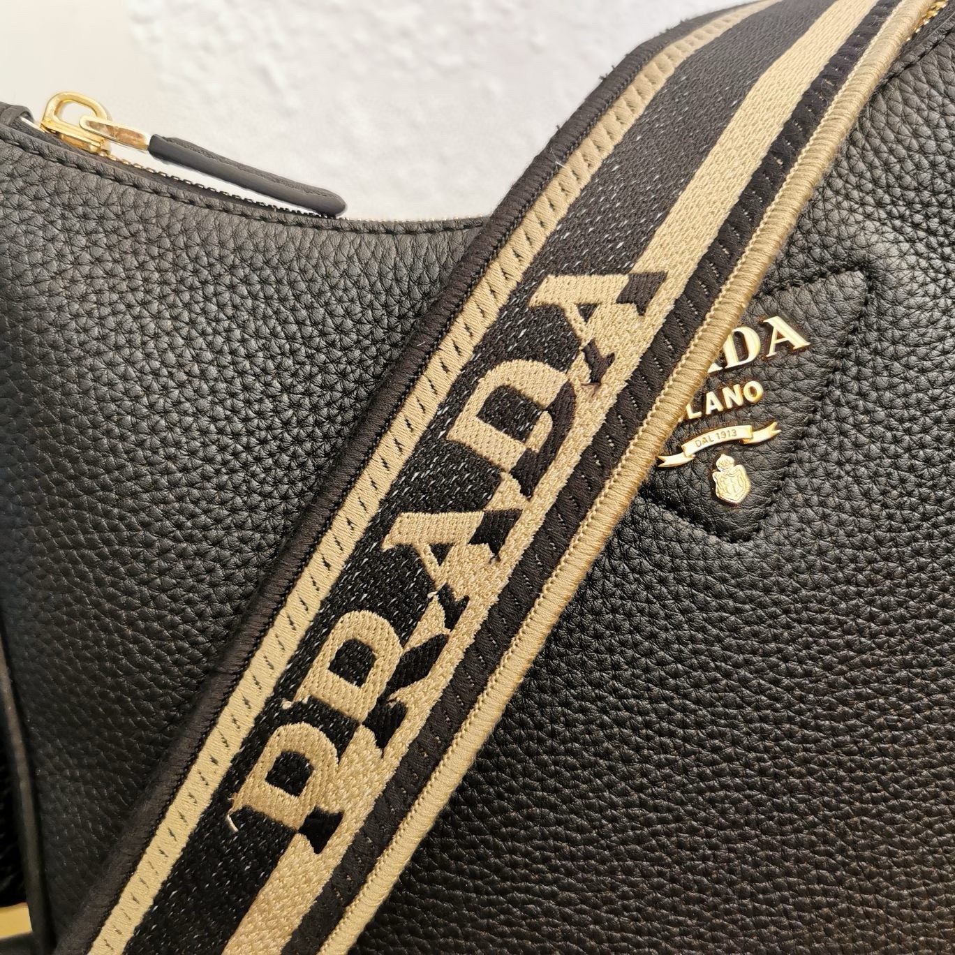 Pra*a shoulder bag in black grained leather