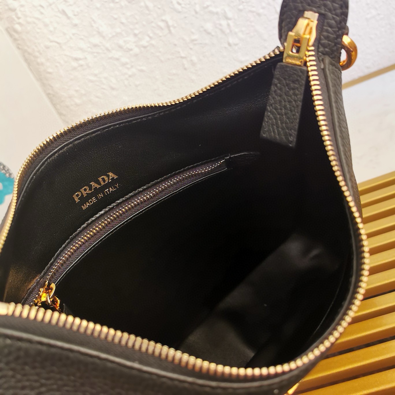 Pra*a shoulder bag in black grained leather