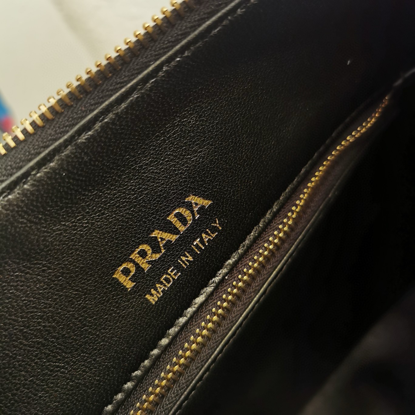 Pra*a shoulder bag in black grained leather