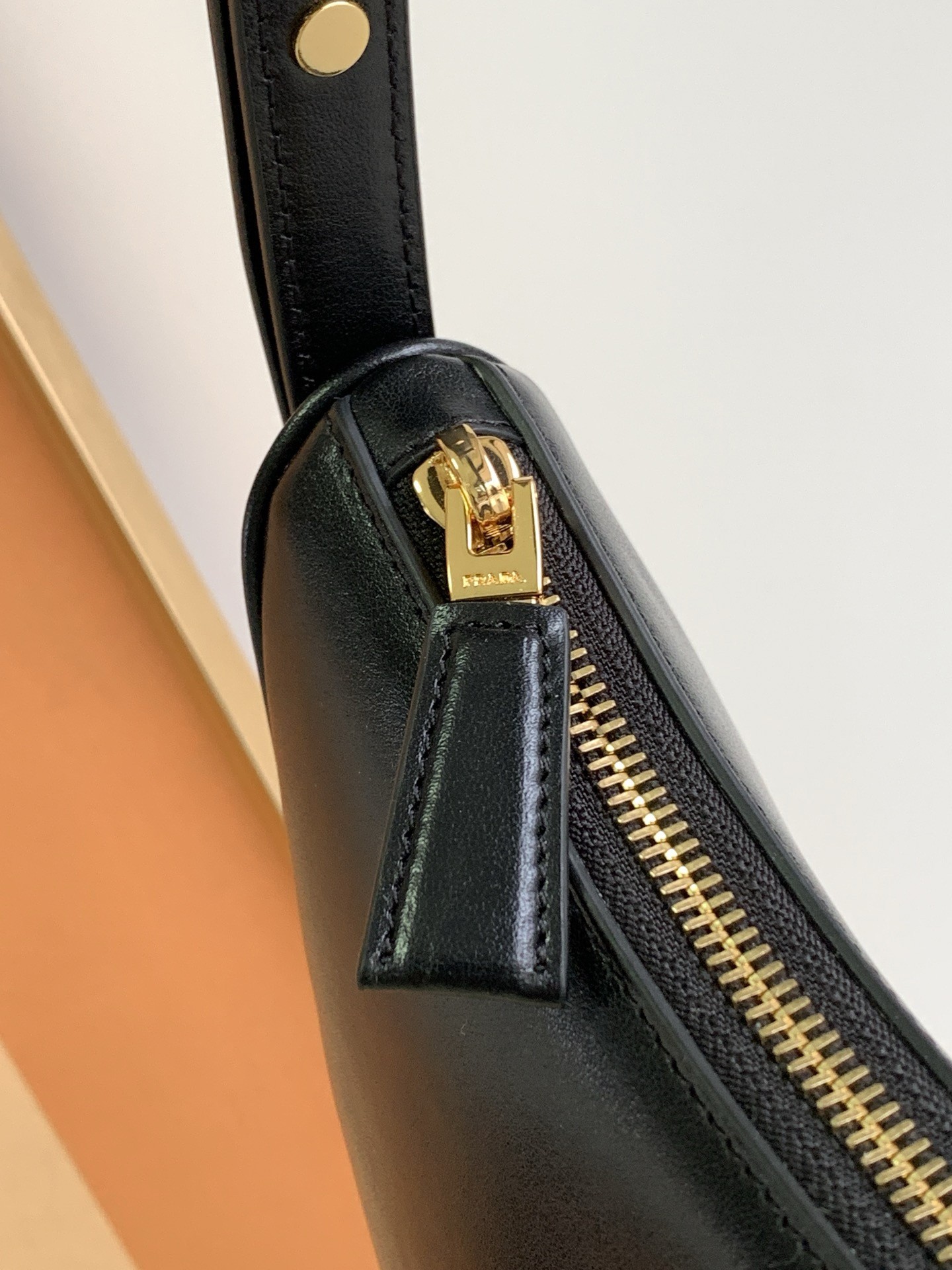 Pra*a arque shoulder bag in black leather