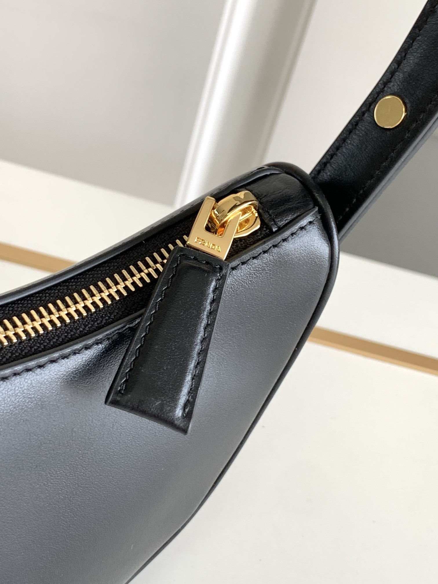 Pra*a arque mini shoulder bag in black leather