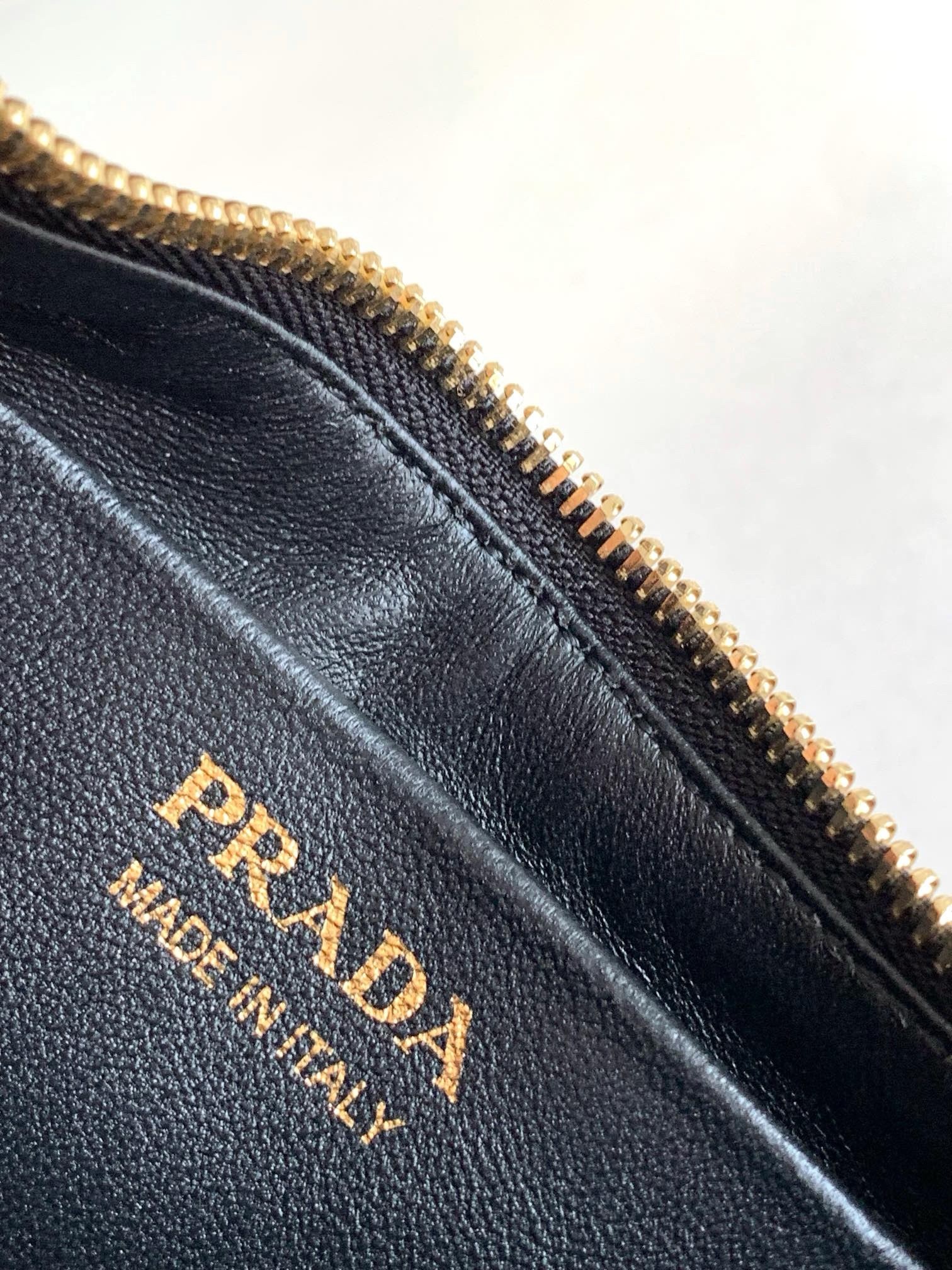 Pra*a arque mini shoulder bag in black leather