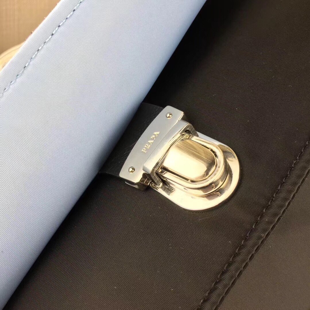 Pra*a etiquette bag in nylon with metal stud trim