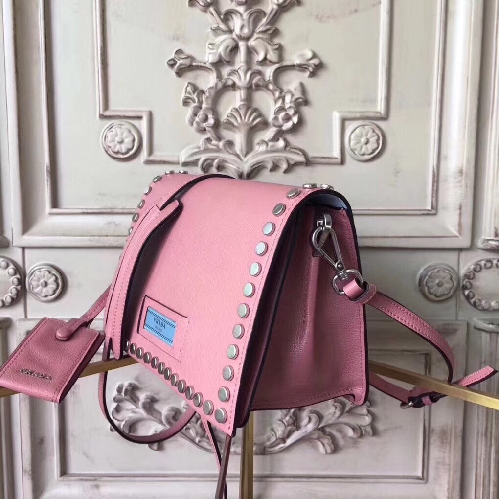 Pra*a etiquette bag in pink calfskin with metal stud trim