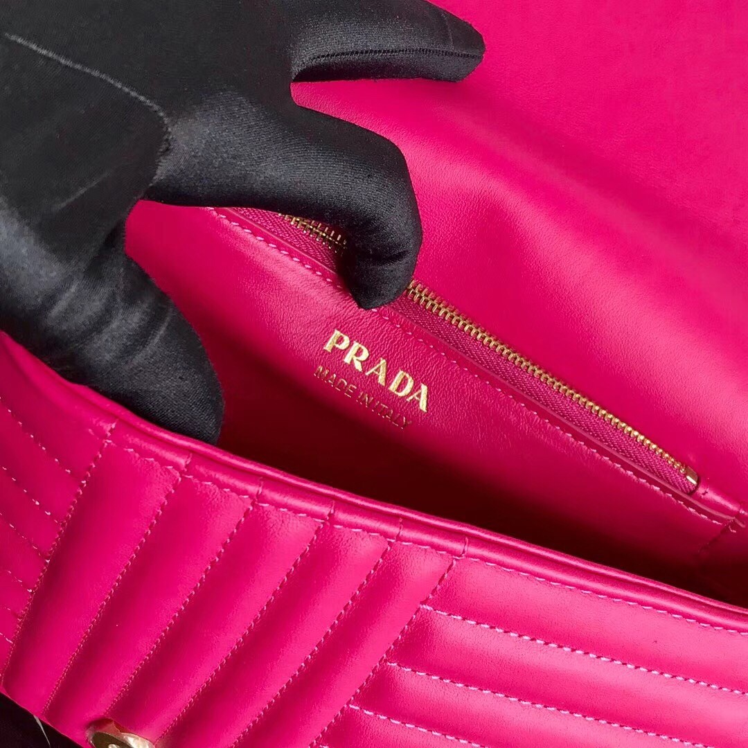 Pra*a medium diagramme flap bag in rose red calfskin