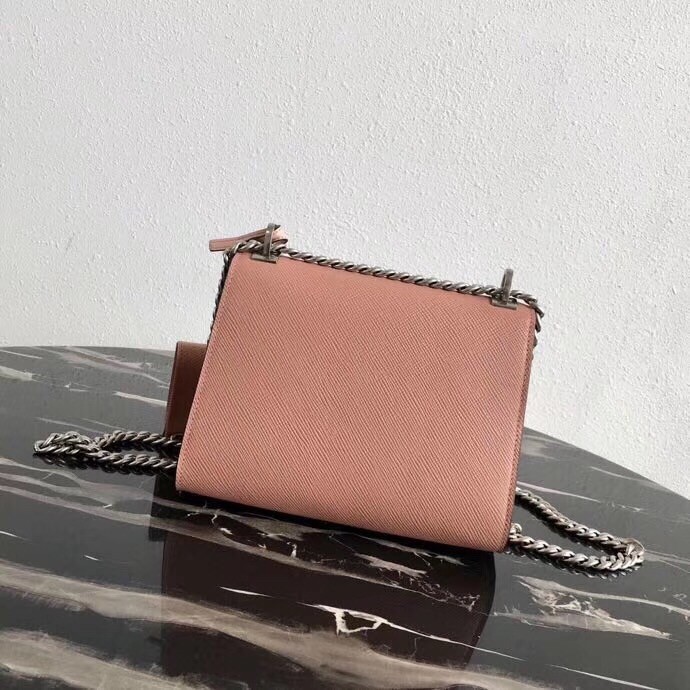 pra*a nude monoCh*0me flap bag with metal appliques