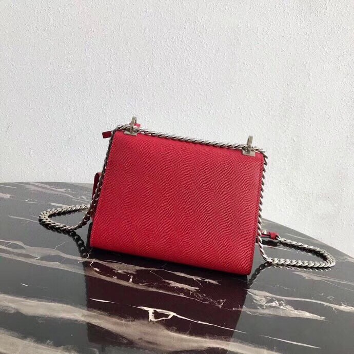 pra*a red monoCh*0me flap bag with metal appliques