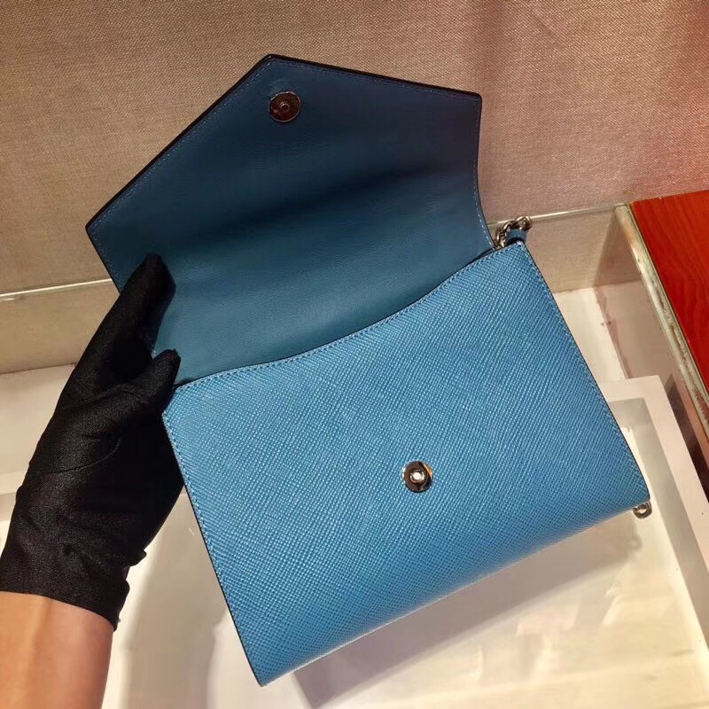 pra*a monoCh*0me flap bag in blue saffiano leather