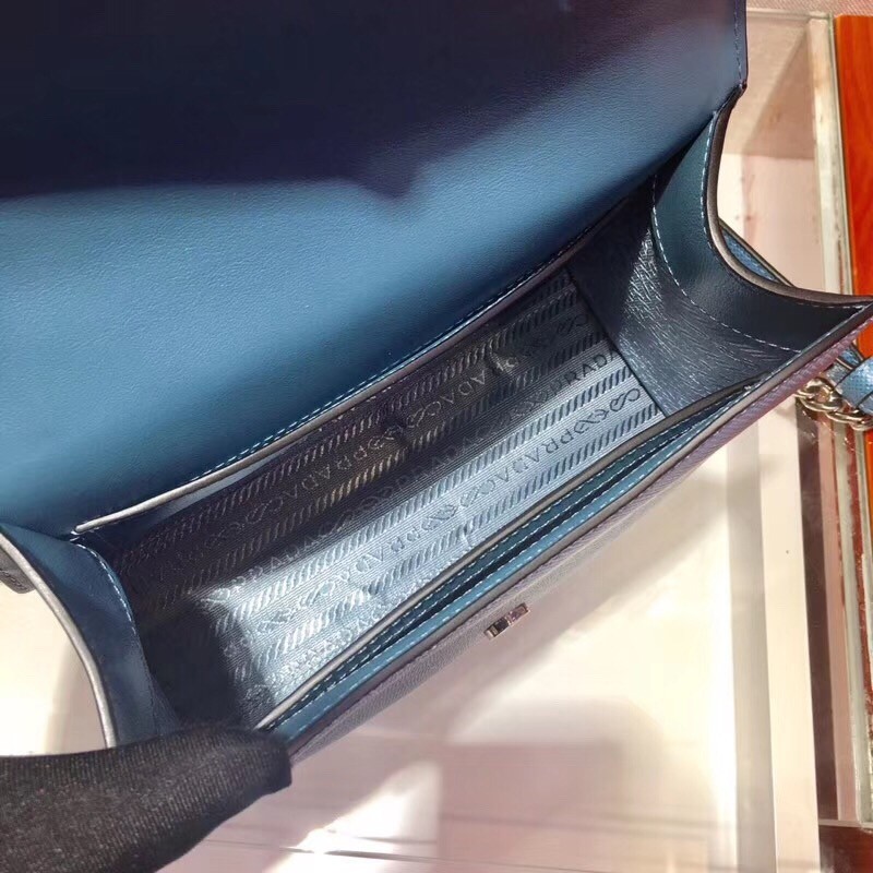 pra*a monoCh*0me flap bag in blue saffiano leather