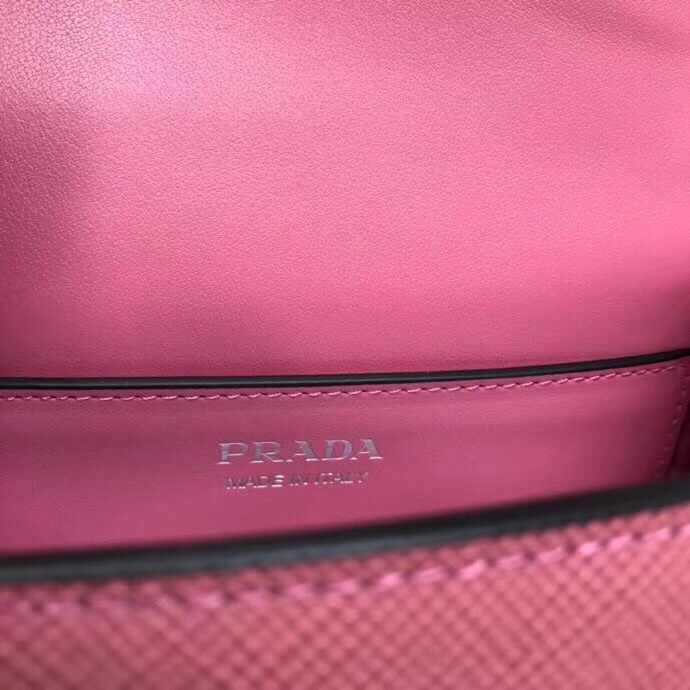 pra*a monoCh*0me flap bag in begonia pink saffiano leather