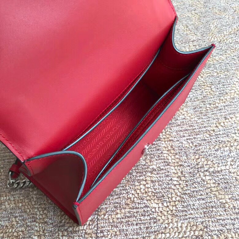 pra*a monoCh*0me flap bag in red saffiano leather