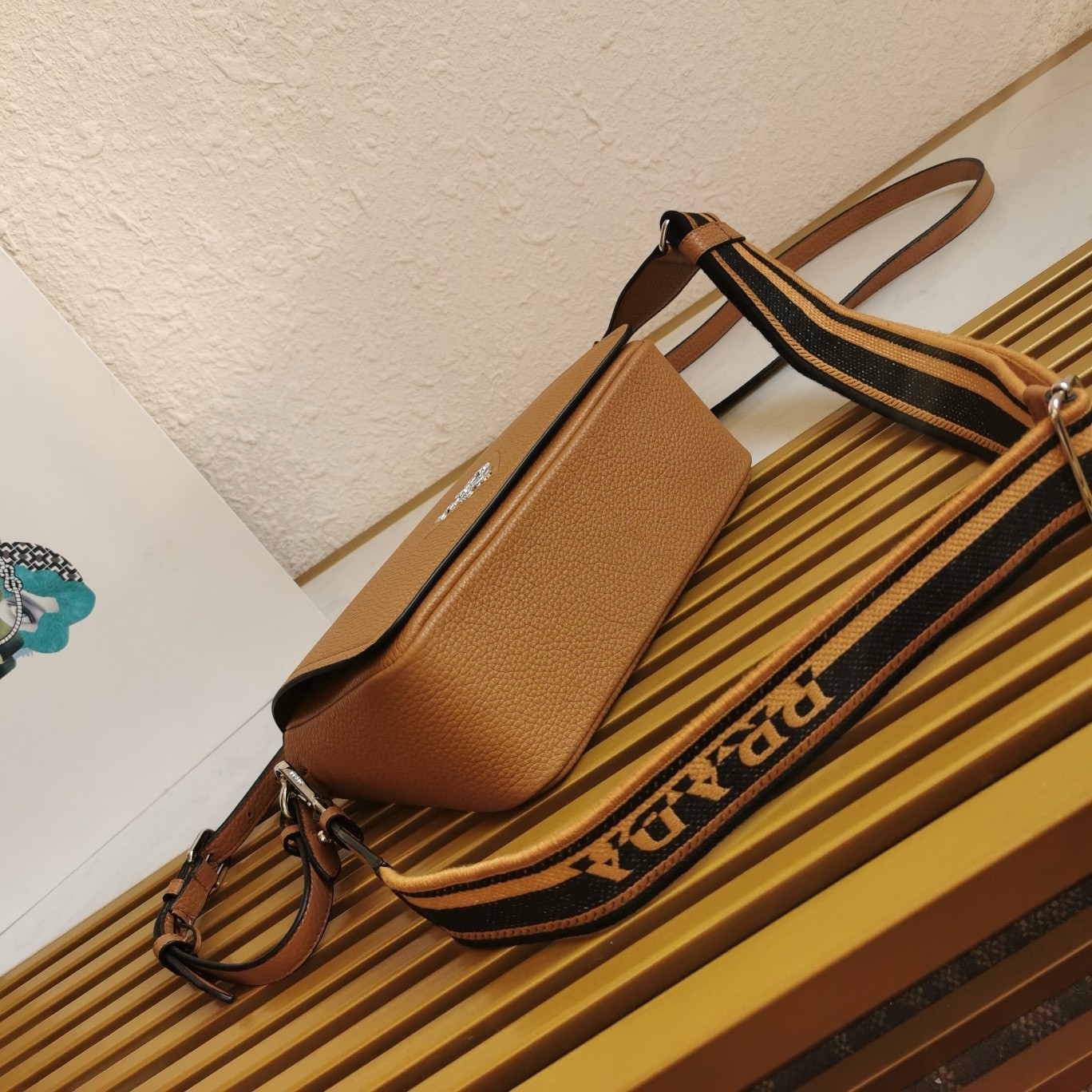 Pra*a flap shoulder bag in brown grained leather