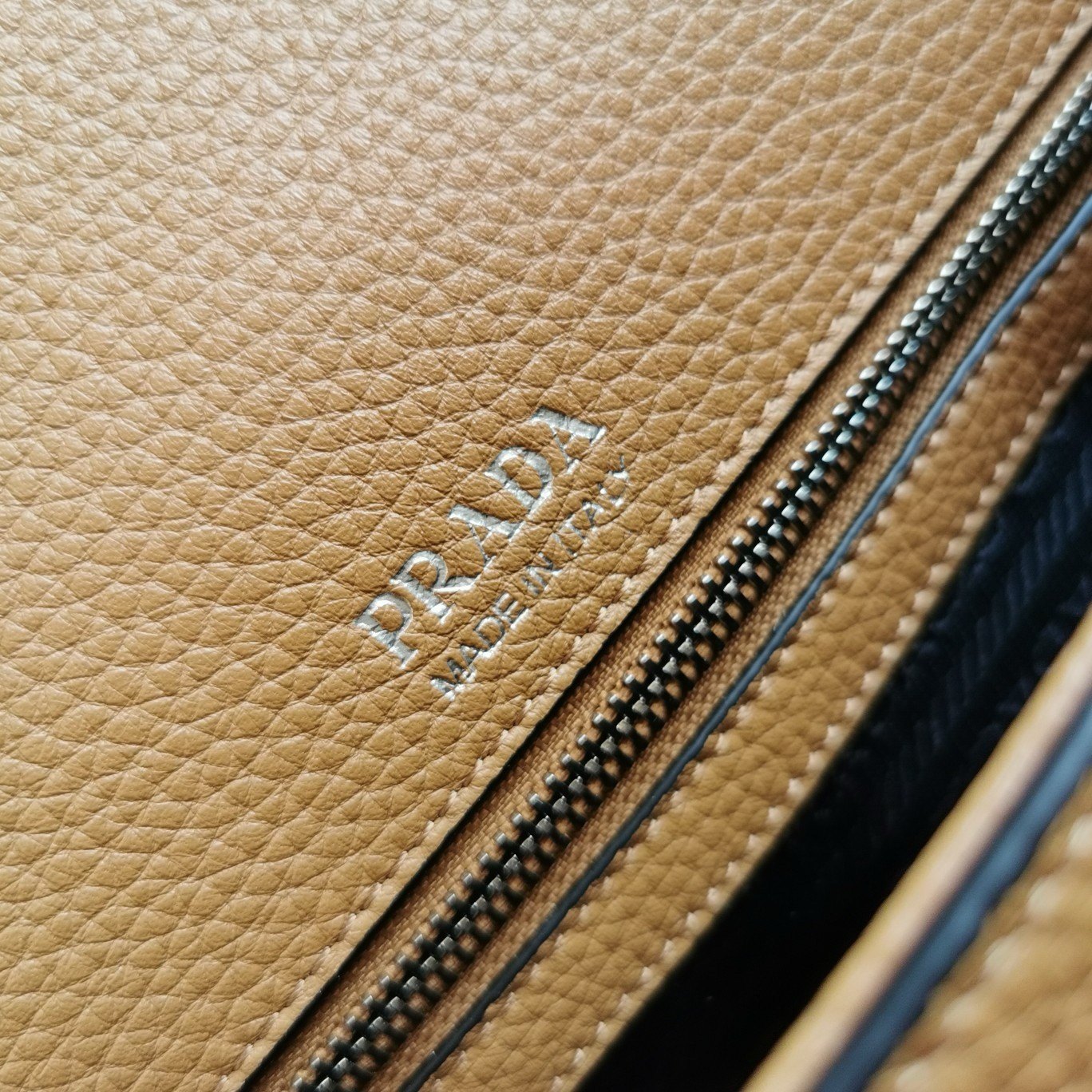 Pra*a flap shoulder bag in brown grained leather