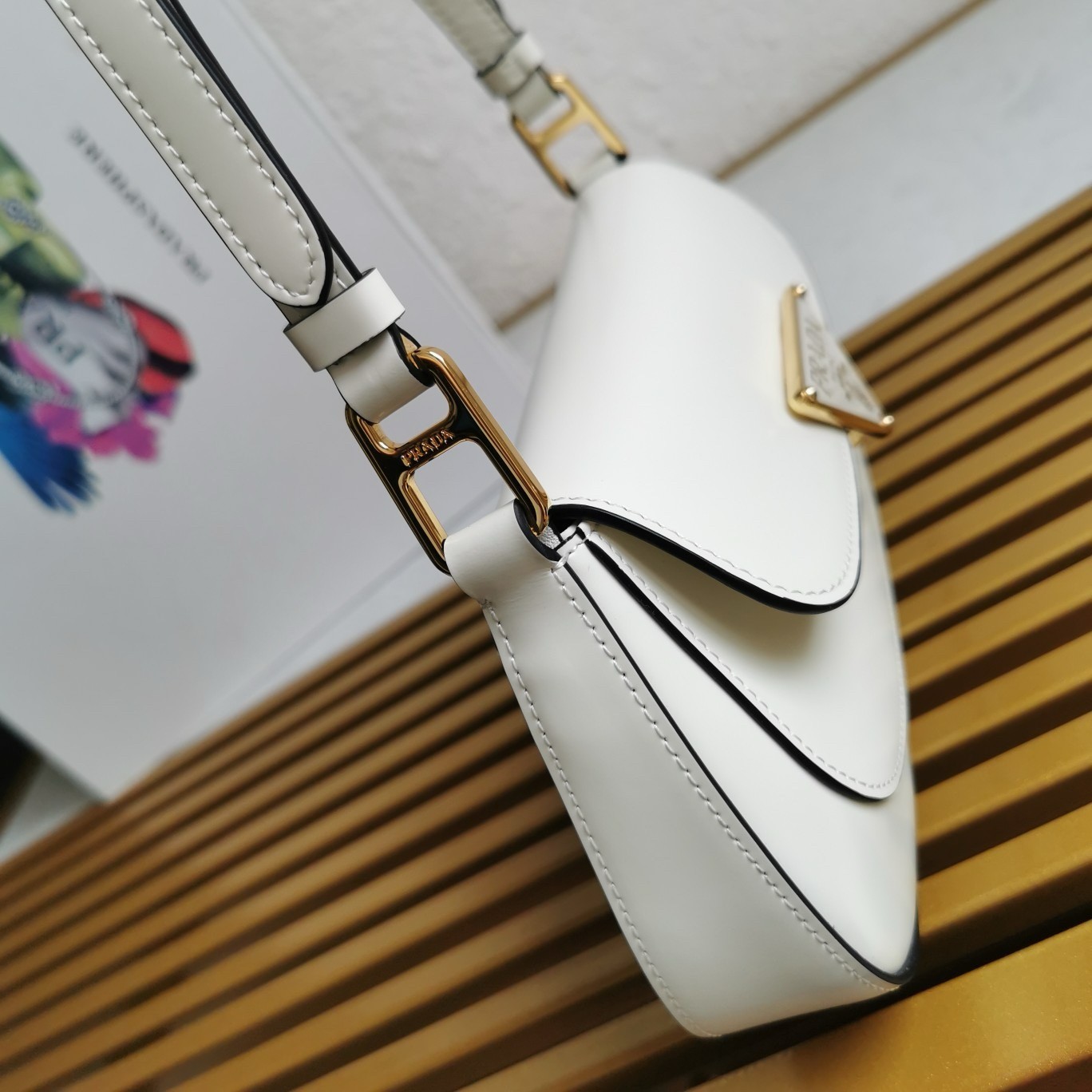 Pra*a shoulder bag in white brushed calfskin