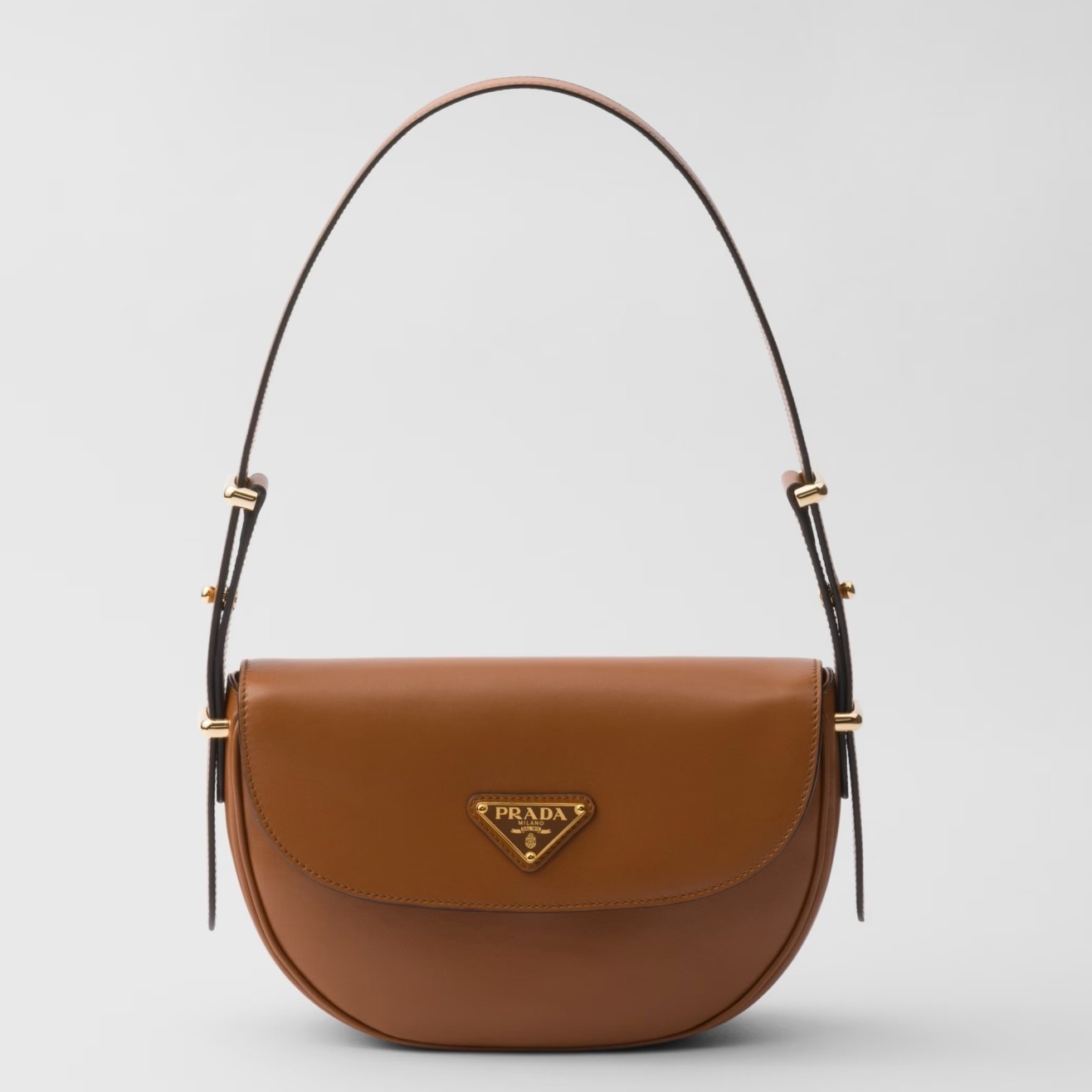 Pra*a arque shoulder bag with flap in brown leather
