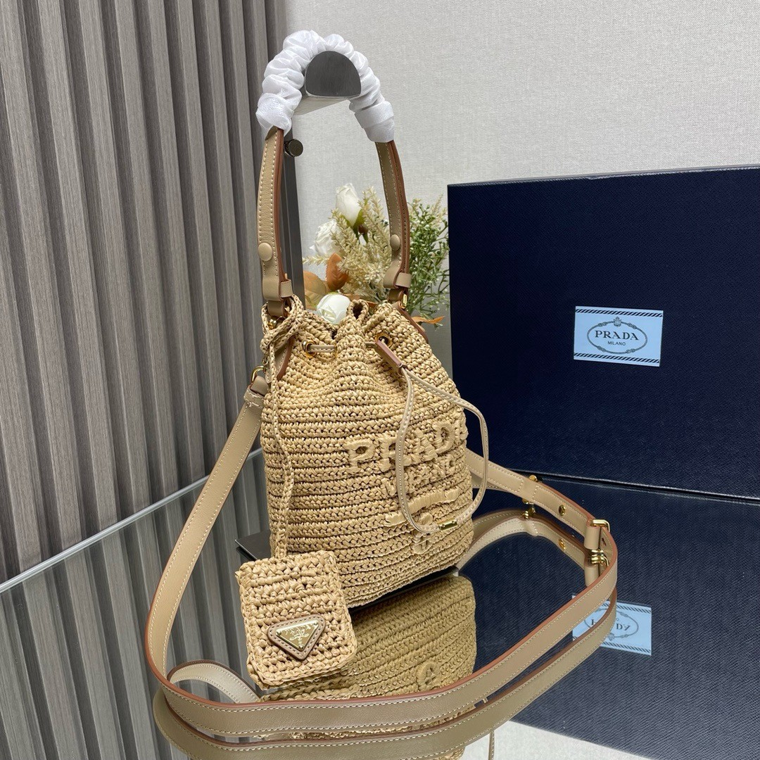 Pra*a crochet mini bucket bag in natural raffia-effect yarn