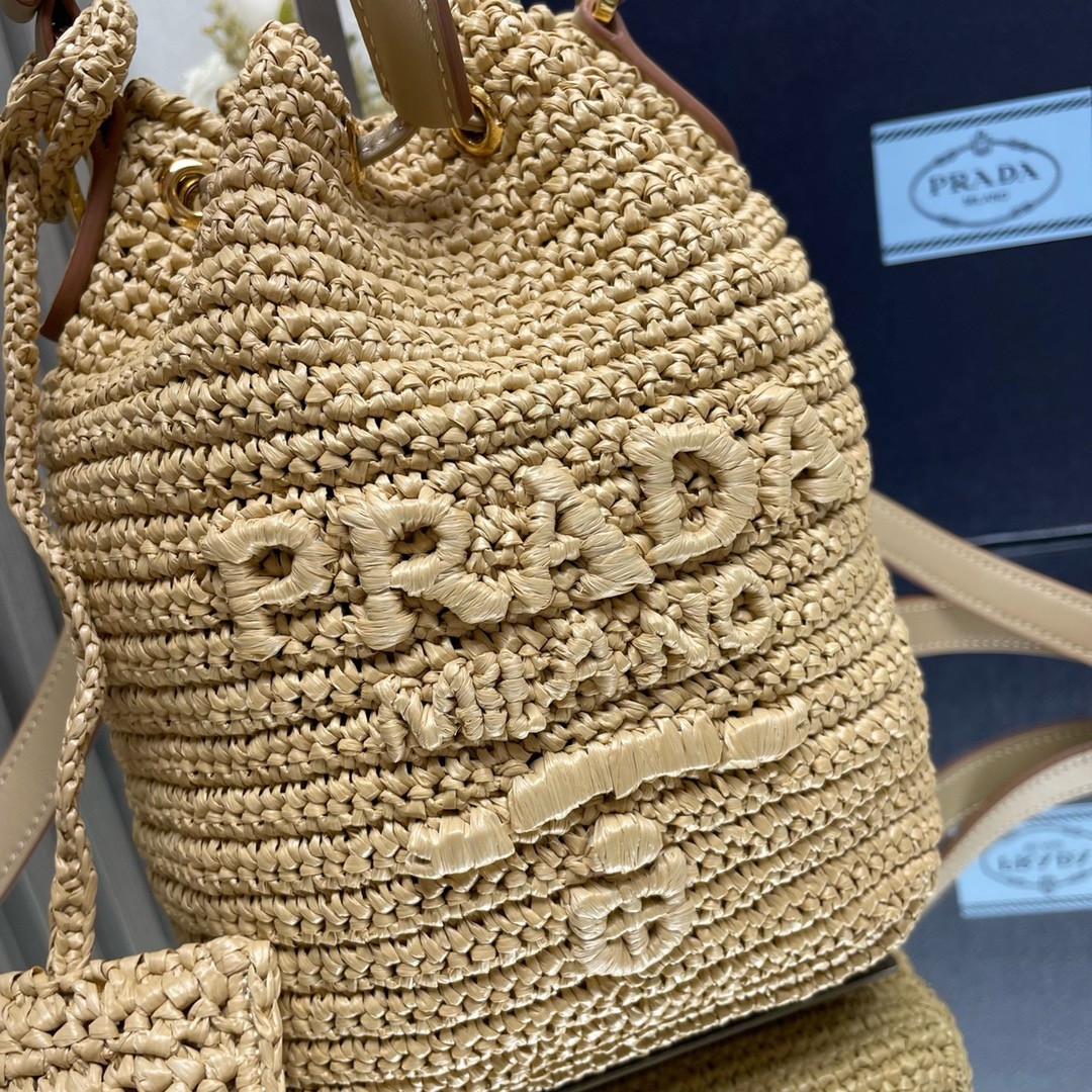 Pra*a crochet mini bucket bag in natural raffia-effect yarn