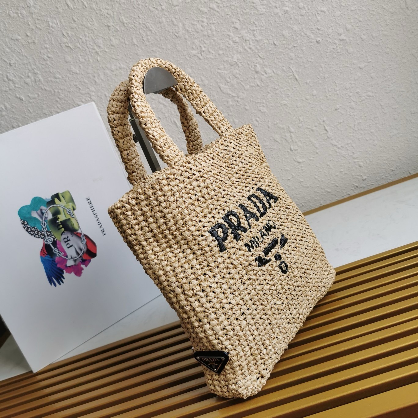 Pra*a small crochet tote bag in beige raffia-effect yarn