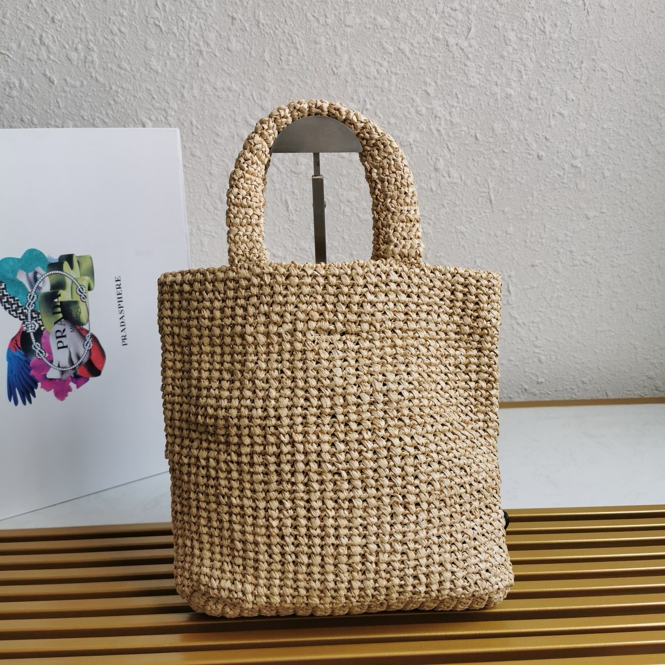 Pra*a small crochet tote bag in beige raffia-effect yarn