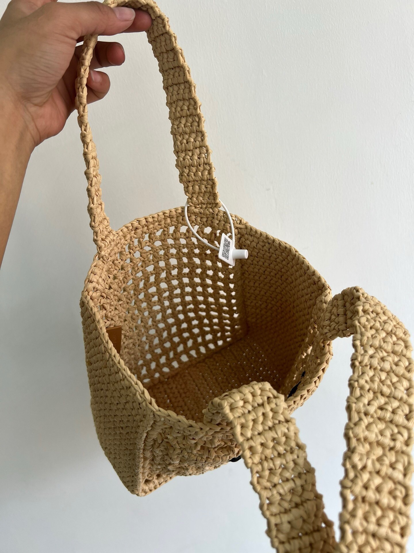 Pra*a small crochet tote in beige raffia-effect yarn