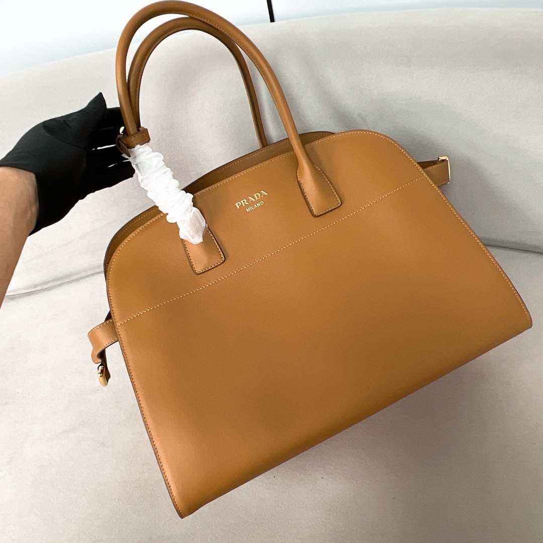 Pra*a large tote bag in brown leather with buckles