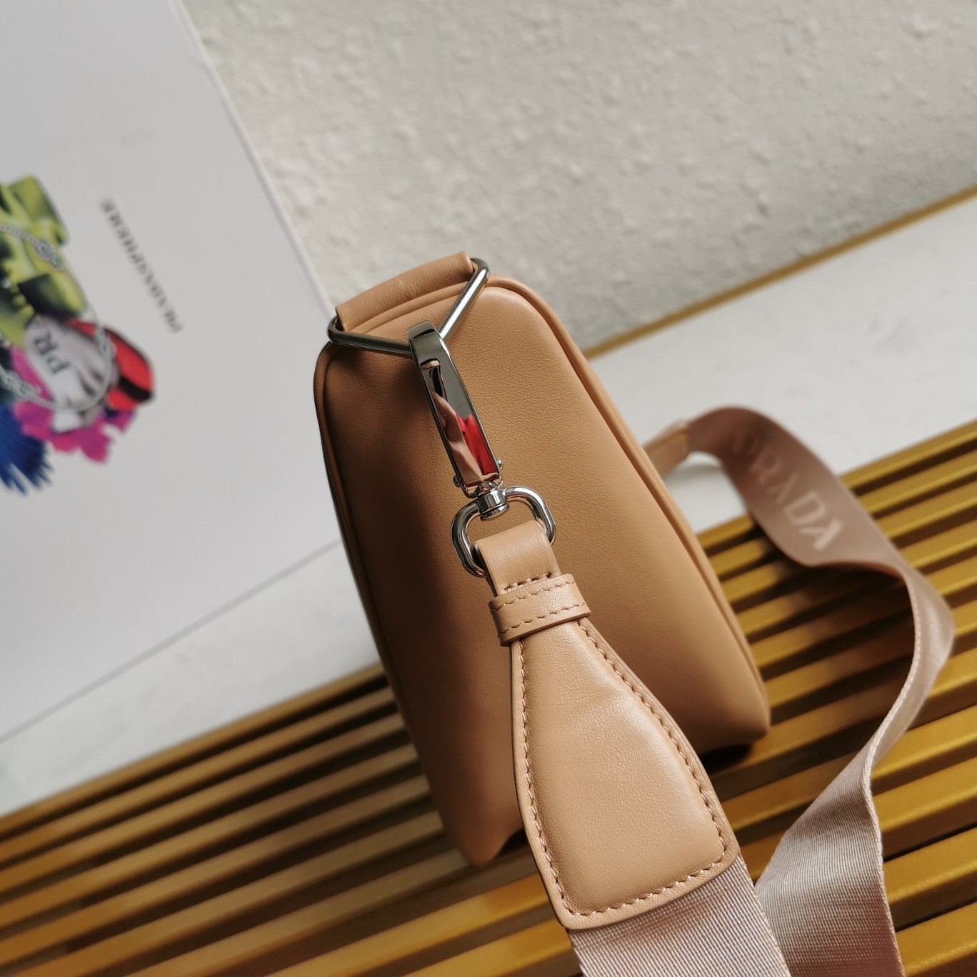 Pra*a triangle shoulder bag in beige leather