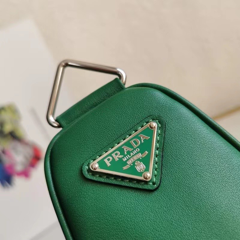 Pra*a triangle shoulder bag in green leather