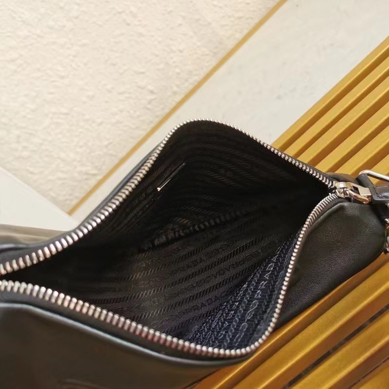 Pra*a triangle shoulder bag in black leather